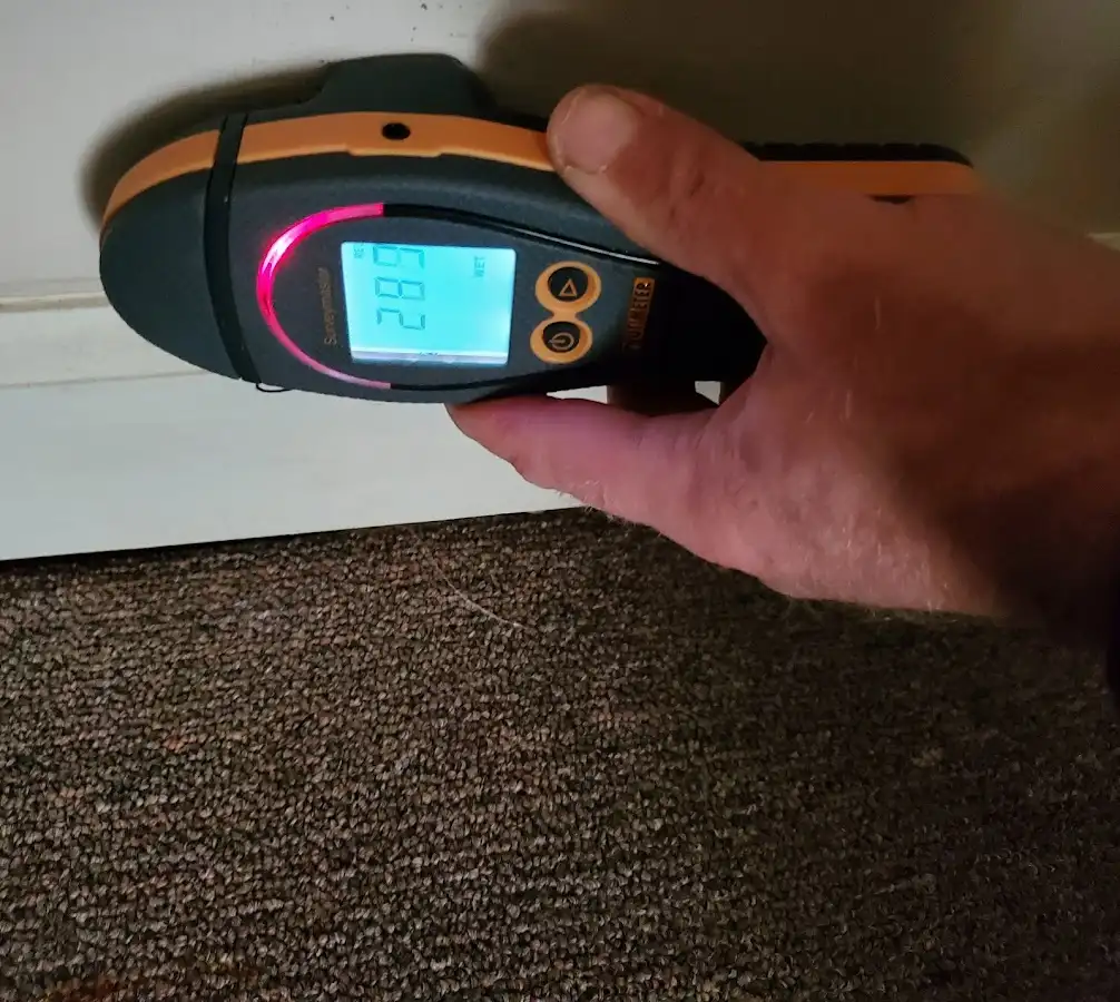 Moisture detection at baseboard during Storm Damage Restoration in Brown Deer